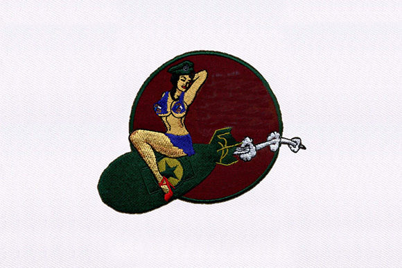 Bomb Perched Woman Design: A Holiday Embroidery Gem